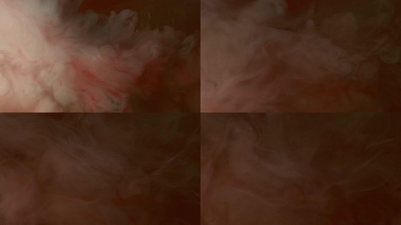 白色和红色的墨水像烟雾或血液在水背景