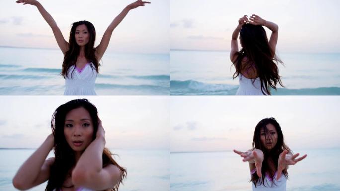 美丽的亚洲华人女性在热带海滩上跳舞
