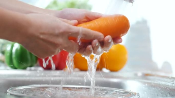 洗水槽里的胡萝卜水洗橙子胡萝卜蔬菜