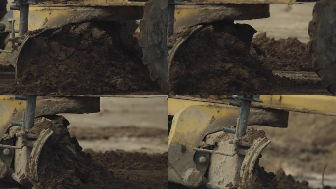 挖土机挖土扔掉挖个深坑