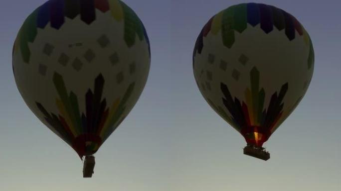 日出时开始飞行的热气球