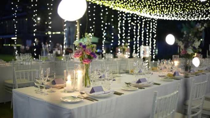 婚礼装饰蜡烛餐饮晚宴豪华活动。节日精致摆台排椅鲜花招待会。