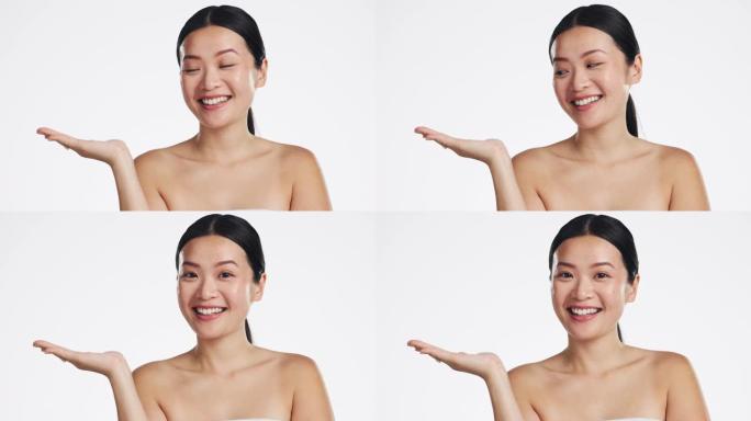 亚洲女人，脸和广告空间的美丽的白色背景，模型和工作室。快乐肖像，女性护肤模型和手营销化妆品促销，产品