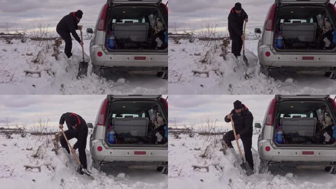 男子在汽车附近用铲子挖雪