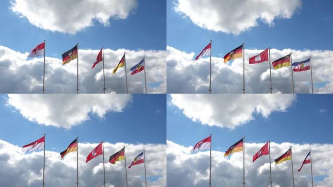 德国联邦各州的几面旗帜在晴朗的天空中迎风飘扬 ．