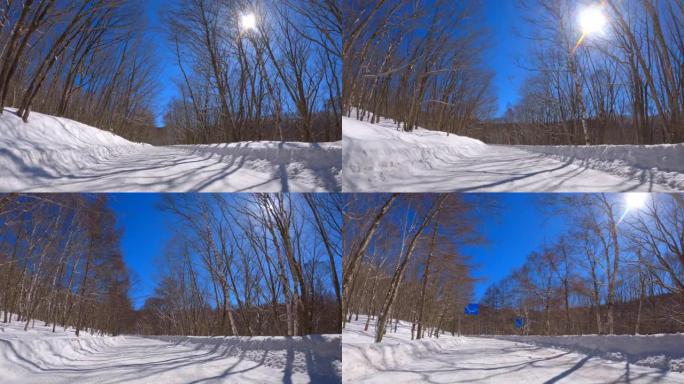 冬季在多雪山区的森林道路上行驶