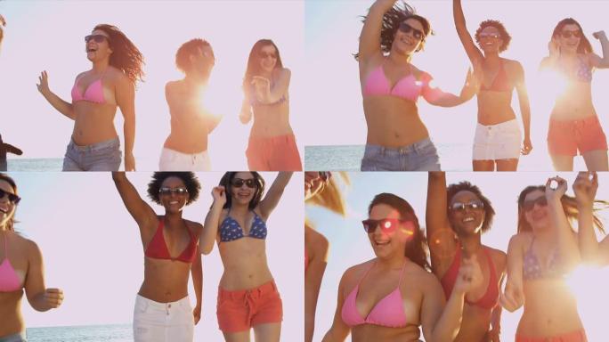 团体青少年度假朋友享受跳舞海滩