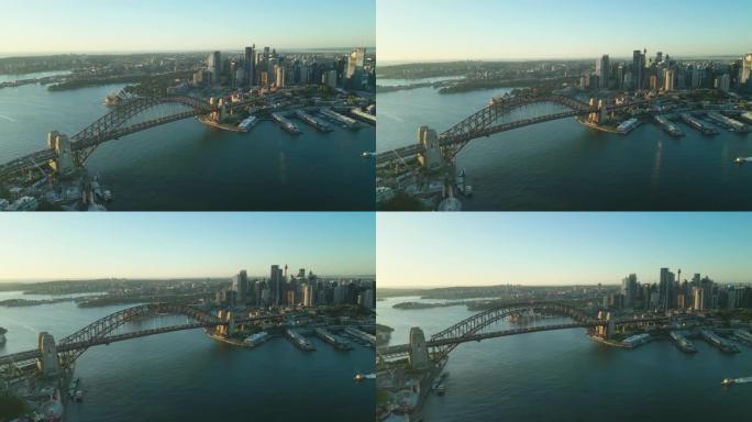 悉尼日出时悉尼海港大桥、各种办公楼和歌剧院上方的4k鸟瞰图实时镜头