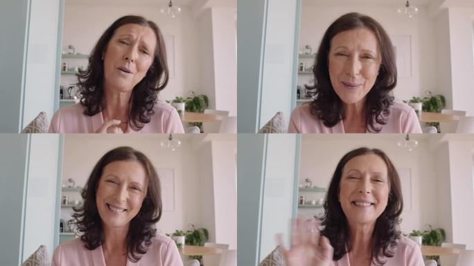 快乐的成熟女人在家使用网络摄像头的手语进行视频聊天聋哑祖母聊天分享生活方式享受水平屏幕上的在线交流