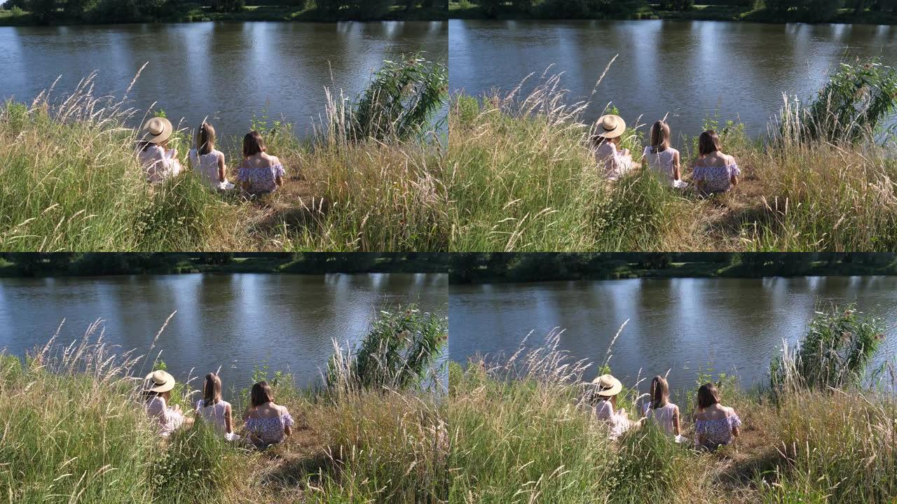 十几岁的姐妹三对双胞胎坐在河边自然，女孩在乡村读书