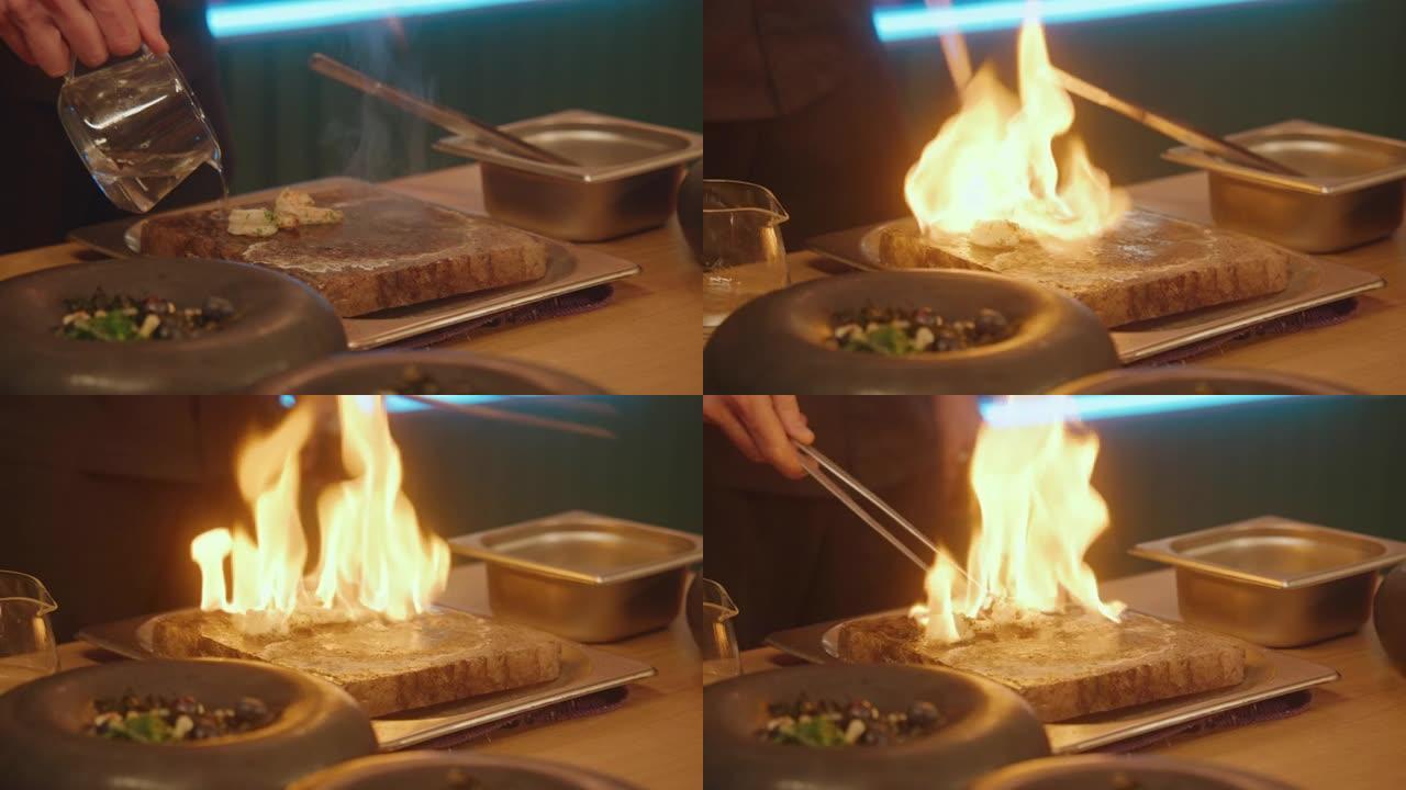 厨师在现代美食咖啡馆以flambe风格烹饪餐点