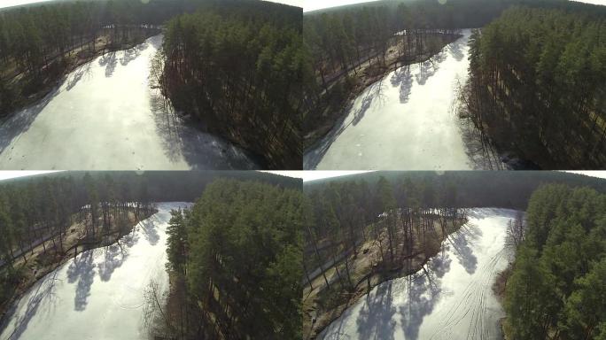 冻湖的冬季木材。空中俯视图