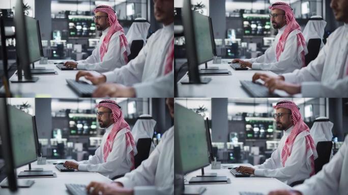 在研究中心工作的中东多元文化男女小组，合作和讨论一个项目，使用计算机编写软件代码，开发人工智能服务