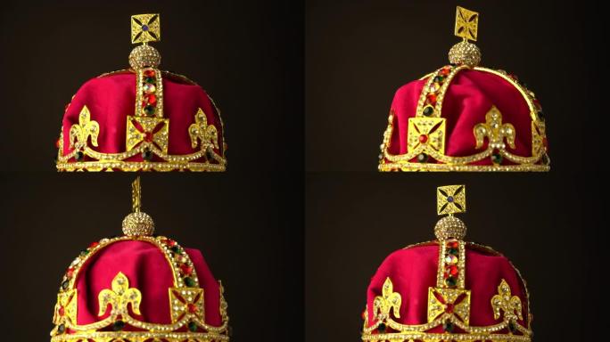 金色和红色皇家柔软天鹅绒材料制成的钻石皇冠，用于黑色背景上的加冕礼。在慢速旋转运动中，焦点集中在框架