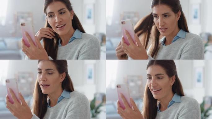 幸福的女人在家用智能手机视频聊天炫耀发型聊天分享激动人心的生活方式享受在线交流4k