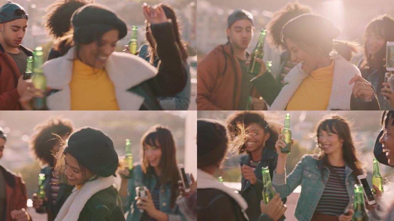 一群多种族的朋友在日落时分在屋顶派对上跳舞，在周末庆祝活动中喝酒，玩得开心