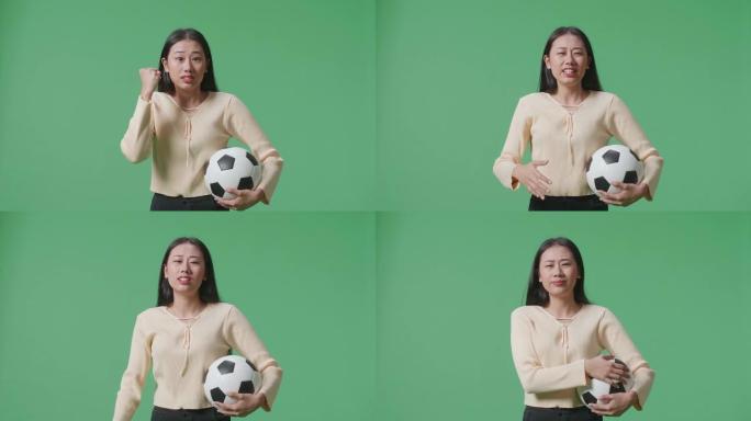 亚洲女子带球正在为射门而生根，并在绿屏背景上欢呼足球时后悔