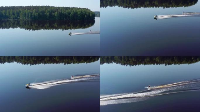 一个十几岁的小伙子正在河上学习滑水