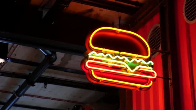 明亮的普通汉堡店，快餐店霓虹灯标志，标牌，彩色霓虹灯广告特写，汉堡三明治符号复古风格，夜生活，酒吧和
