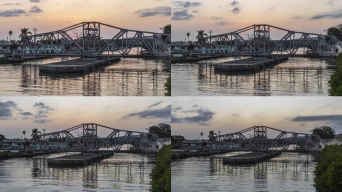 日落时古巴圣胡安河上的马坦萨斯秋千桥