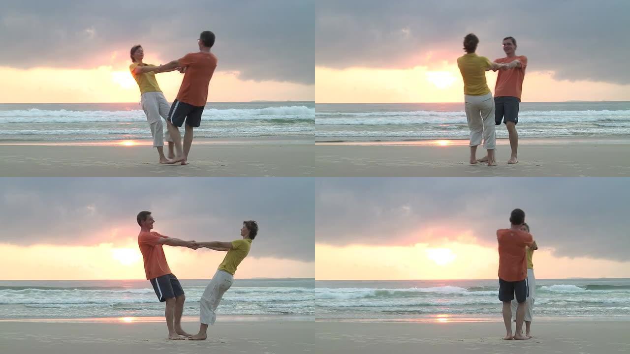 海滩上快乐跳舞的情侣