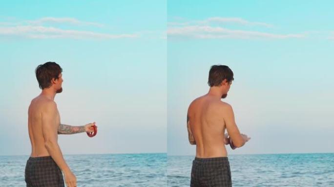 海滩上的一个人把渔具扔进海里。垂直。社交媒体