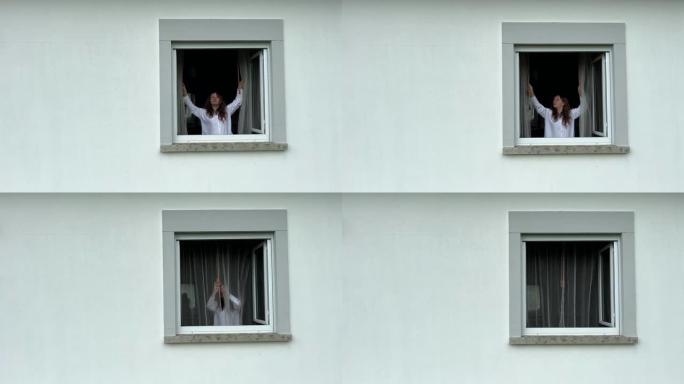 一个十几岁的女孩劈开白色的窗帘，看着白色的窗户。她在视频的右侧。在左侧，有很多文字空间。她向外看并微