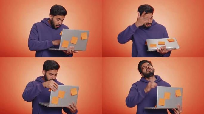 疲惫疲惫的印度自由职业者用粘贴的贴纸笔记使用笔记本电脑，大的日常工作负荷