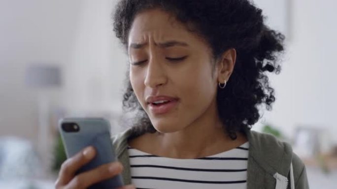 非裔美国妇女使用智能手机进行视频聊天挥手问候朋友在手机上聊天4k
