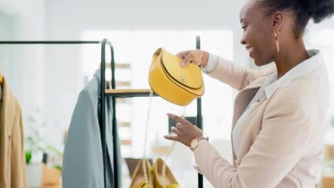 黑人女性，时尚和货架库存展示在小企业或零售店。快乐的非洲裔美国女性服装设计师在精品店的广告或营销货架