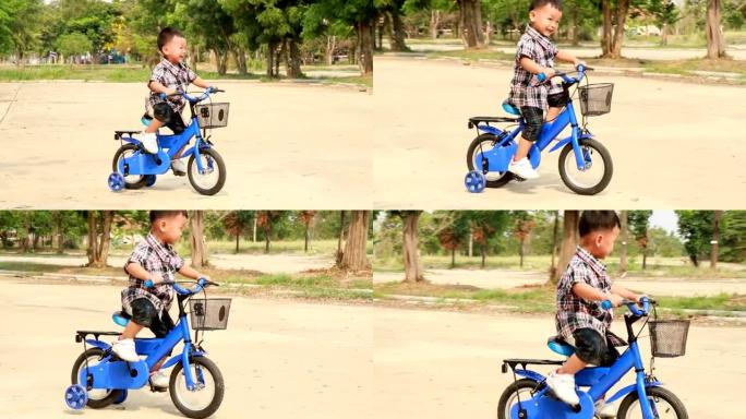 小男孩学会骑自行车