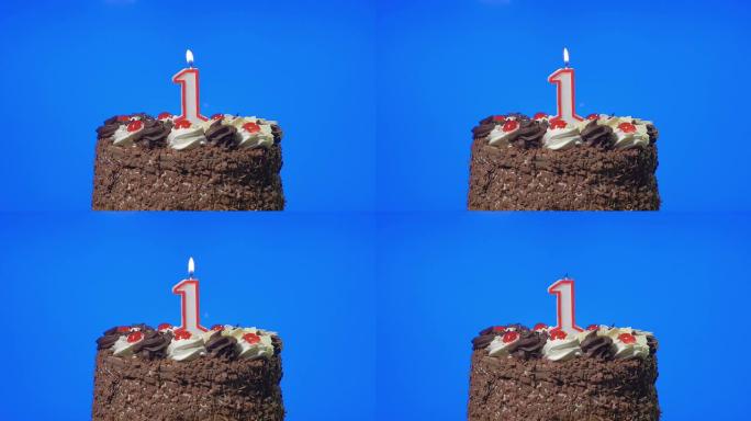在美味的巧克力蛋糕上吹出第一个生日蜡烛，蓝屏