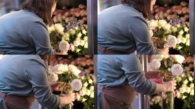 从最受欢迎的花店精心制作的春天花束，花卉商店冰箱储存鲜花。
