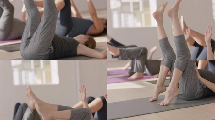 在工作室享受团体健身锻炼的健康孕妇瑜伽课