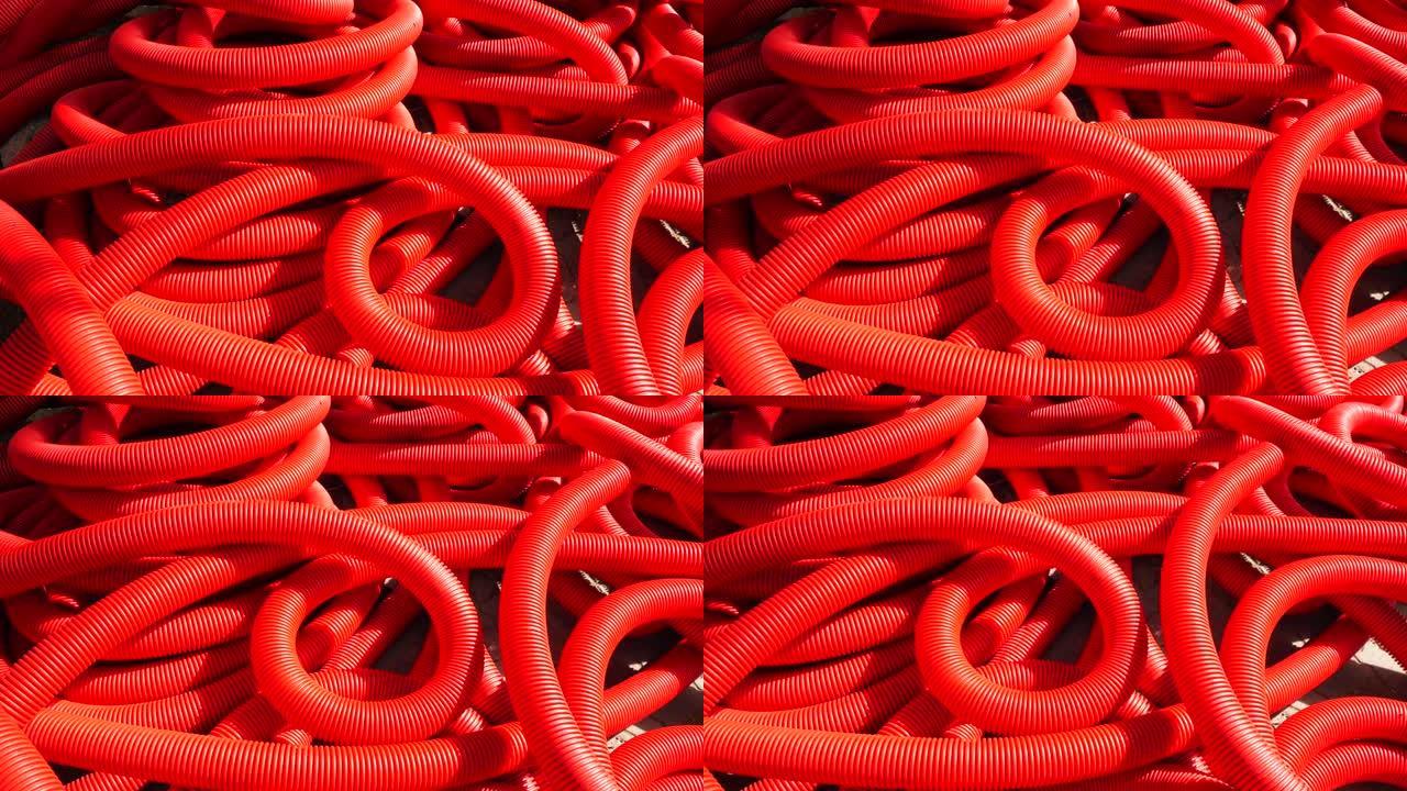 工业背景。塑料波纹管，卷内排水，特写。红色管道或管道。慢动作。