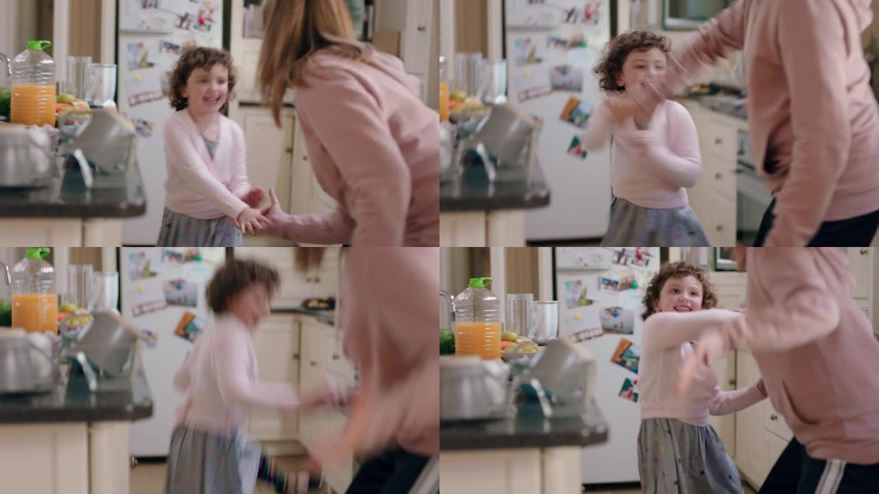 快乐的十几岁的女孩和妹妹在厨房跳舞，兄弟姐妹周末一起在家享受有趣的舞蹈