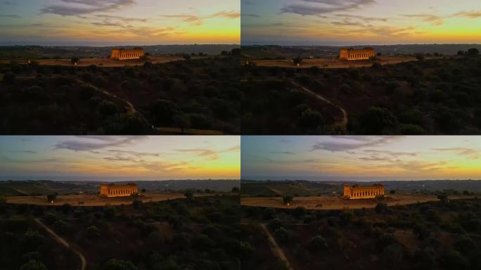 无人机拍摄照亮的康科迪亚神庙在日落景观