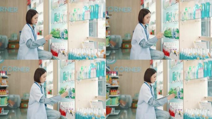 亚洲专业女药剂师使用数字平板电脑检查药房的药品库存。小企业。工作。健康的概念。