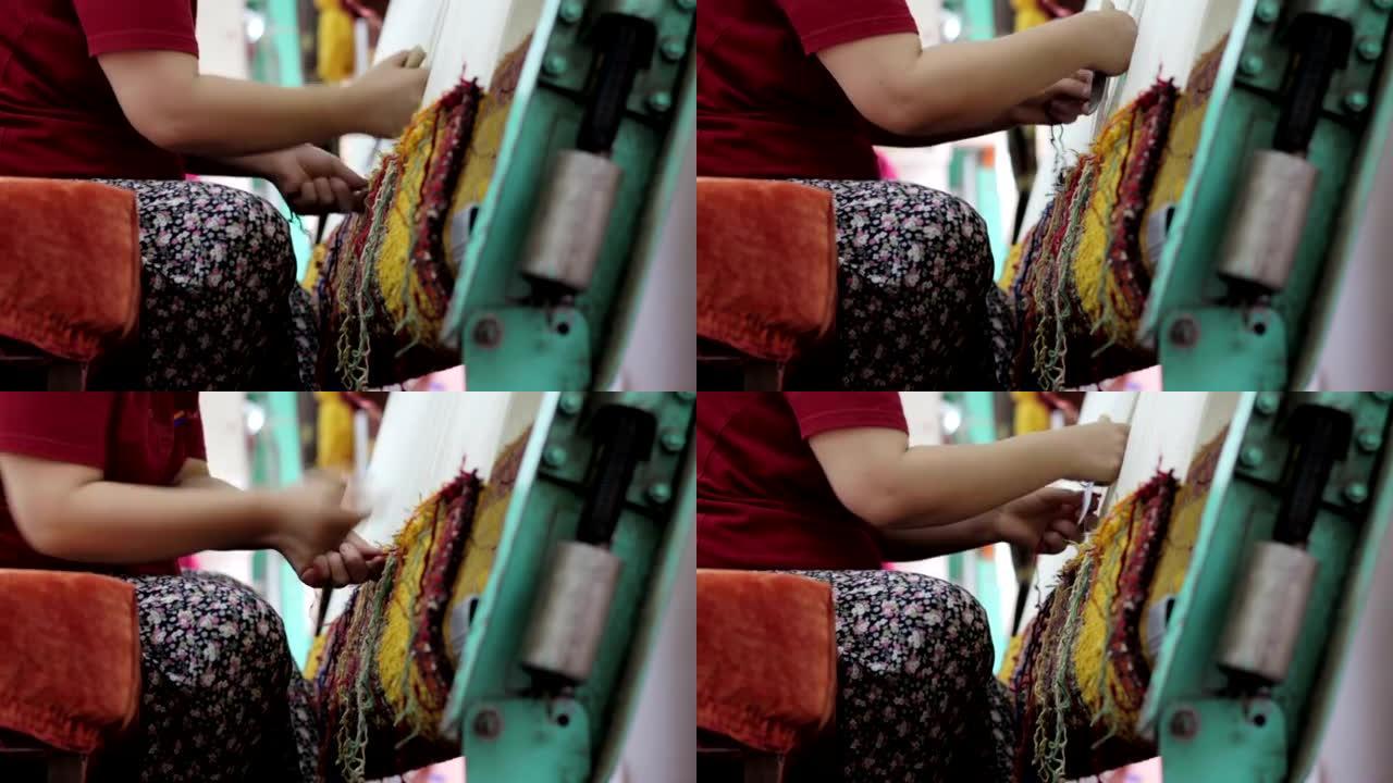 编织东方地毯的老年妇女: 土耳其地毯