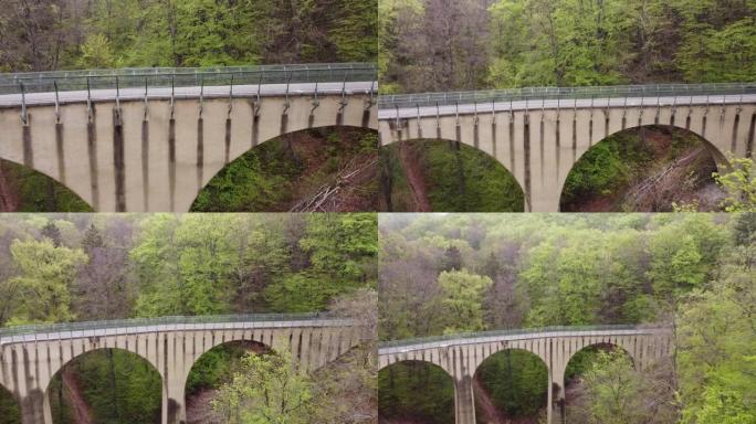 空中推动上升飞越桥梁。森林里高架桥边的桥。