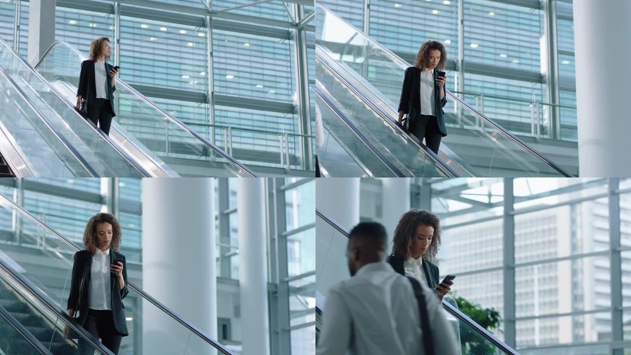 混血女商人在自动扶梯上用智能手机发短信上网查邮件成功女高管离开公司办公室4k视频