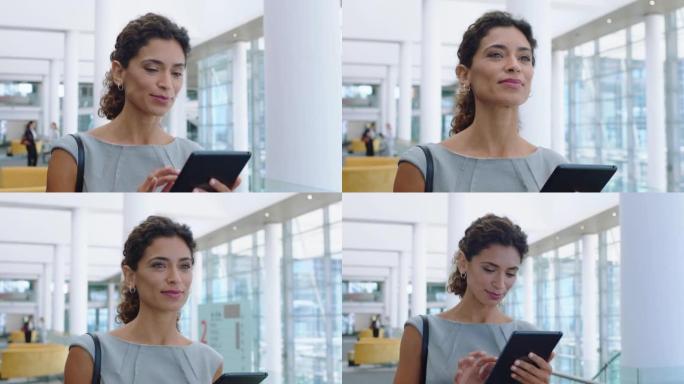西班牙裔女商人用平板电脑在触屏设备上查看电子邮件输入信息成功的女高管在公司办公室行走4k画面