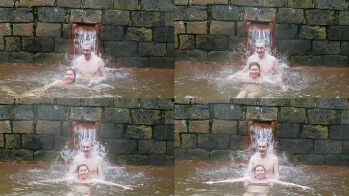 夫妇在葡萄牙亚速尔群岛温纳斯温泉洗澡
