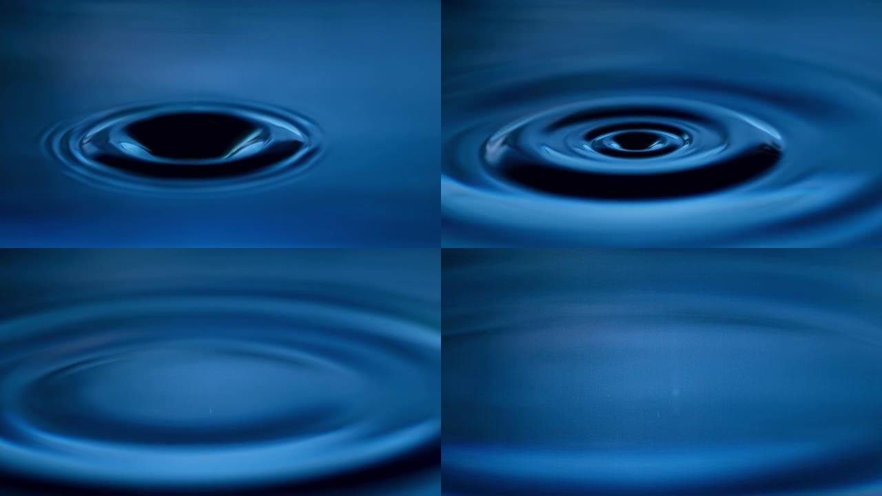 超慢动作极限特写液滴下落和涟漪蓝色水面