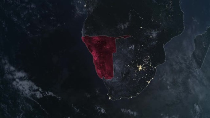 突出显示的纳米比亚黑色地图，通过4K照片真实动画地球从太空放大，全景包括非洲、西欧和美国。史诗旋转的