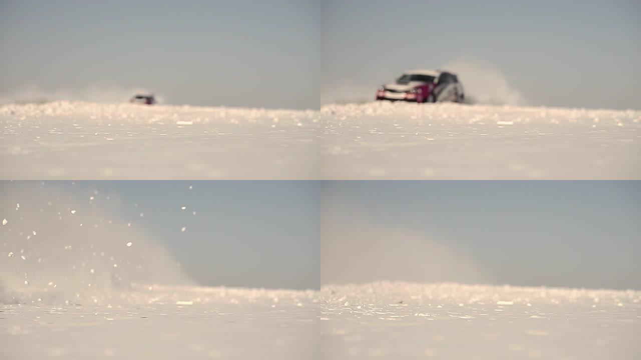 赛车在深雪中快速行驶。一片片雪落在前景上。