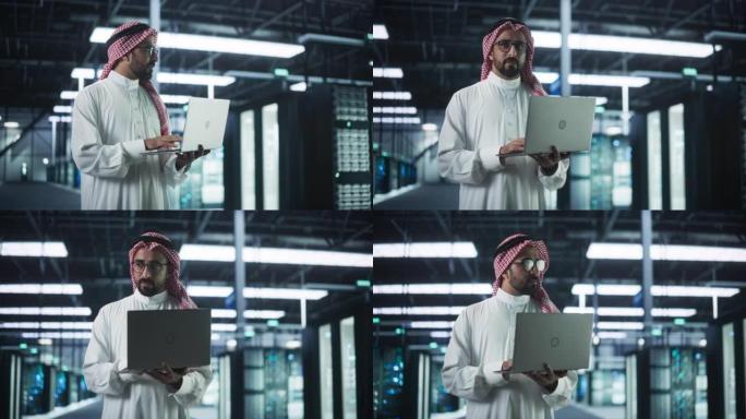 穆斯林数据中心IT工程师站在一个带有操作服务器机架的房间里。云计算架构师使用笔记本电脑为网络安全和数