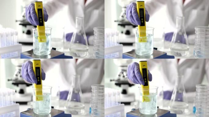 科学家在实验室中使用化学溶液和实验室测试水质或ph计