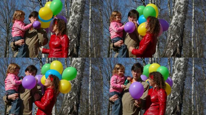 春天森林里有一堆气球的家庭