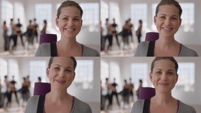 肖像美丽的白人妇女笑着享受瑜伽课，在健身室练习健康的生活方式